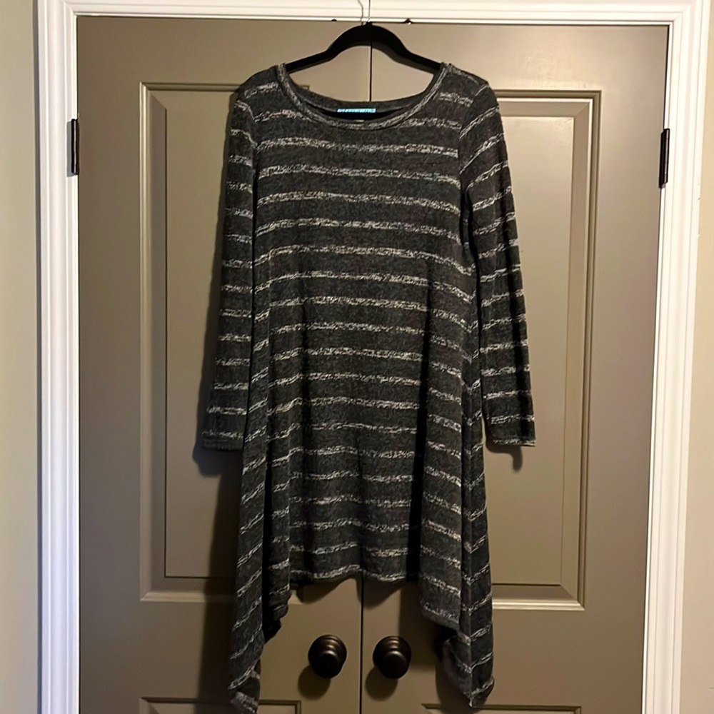 Striped knit dress with asymmetrical hemline.